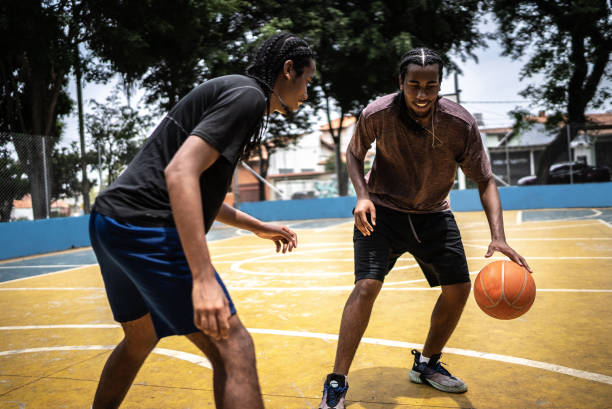istock Young men playing basketball 1448876988