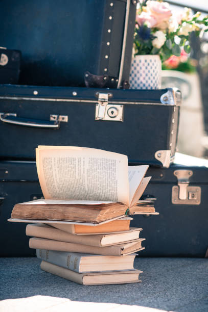 istock Aged books old suitcases retro-style setup 1448877269
