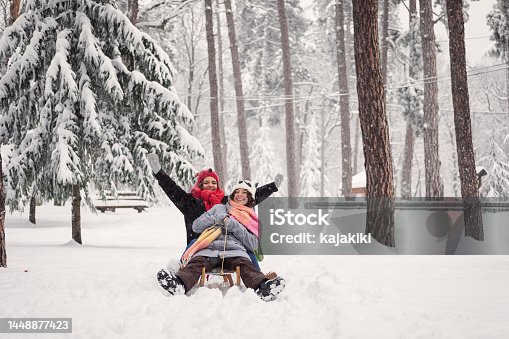 istock Beautiful  Teenage Girls Playing in Snow 1448877423