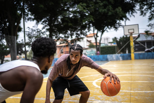 istock Young men playing basketball 1448877424