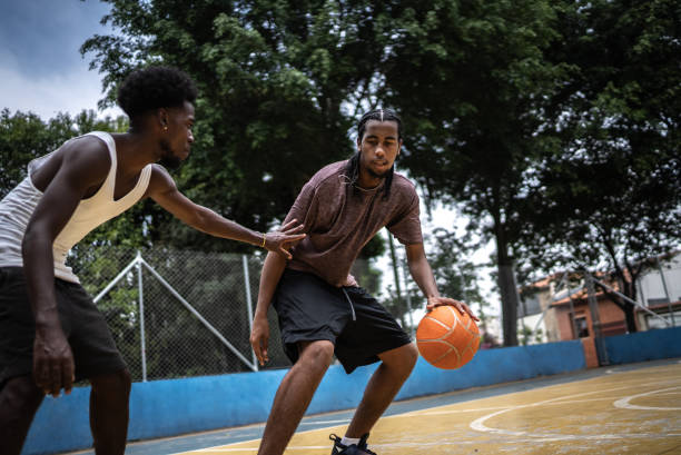 istock Young men playing basketball 1448877428