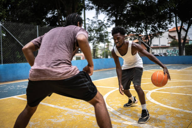 istock Young men playing basketball 1448877456