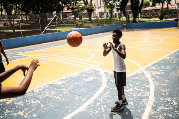 istock Young man playing basketball 1448878306