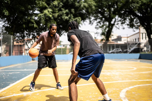 istock Young men playing basketball 1448878413