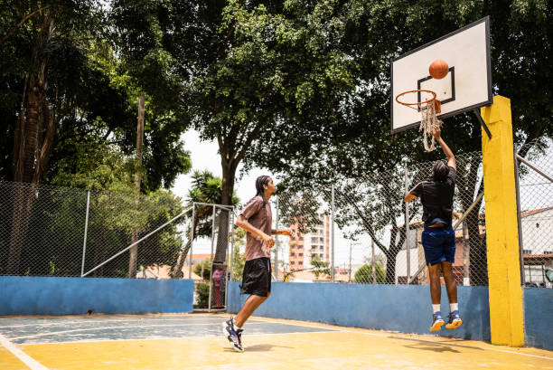 istock Young men playing basketball 1448878450
