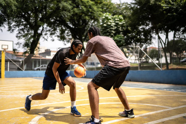 istock Young men playing basketball 1448878453