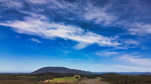 istock Scenic view of hills under the peaceful blue sky 1448878529