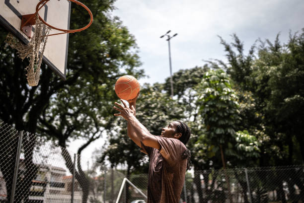 istock Young man playing basketball 1448878975