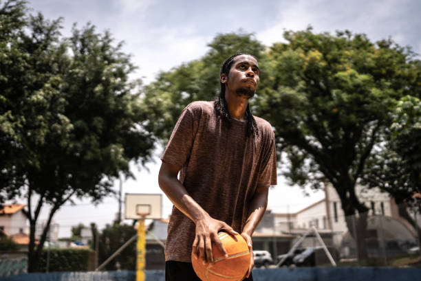 istock Young man playing basketball 1448879102