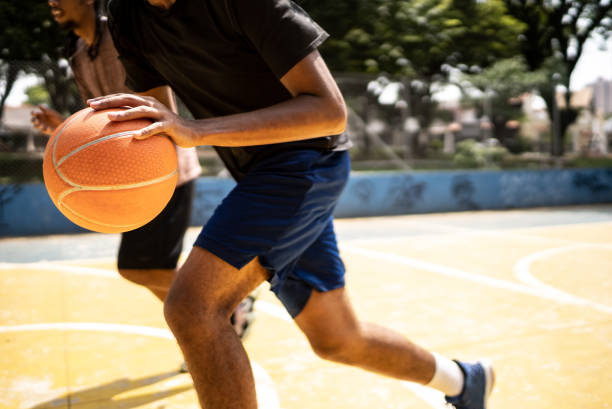 istock Young men playing basketball 1448879104