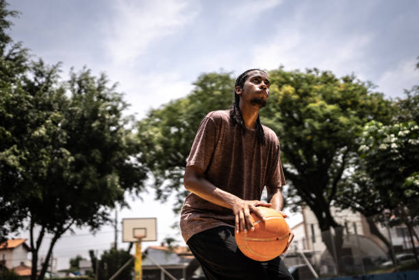 istock Young man playing basketball 1448879115