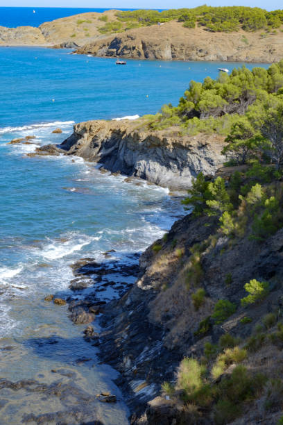 istock Cliff rocks on a sandy beach shore summer landscape in Costa Brava, Catalonia 1448880304