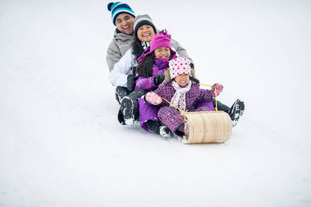 istock Family Tobogganing Together 1448885852