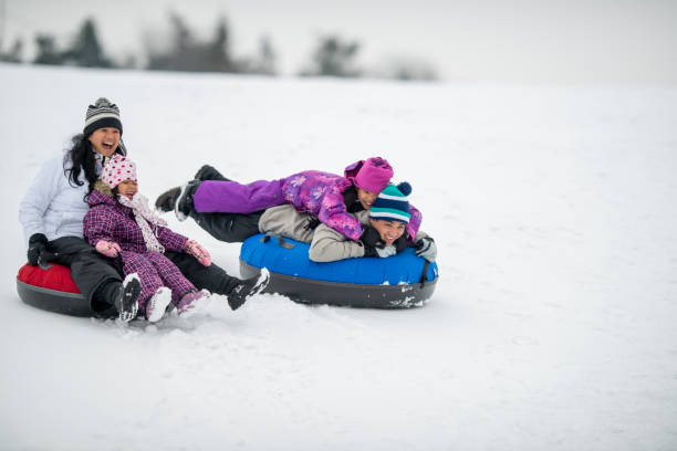 istock Family Tubing Together 1448885867