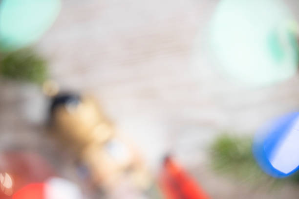 A blurred photo of ornaments and Christmas lights as background