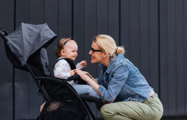 istock Loving Mother Being Affectionate With Her Daughter While Outside on a Walk 1448889681