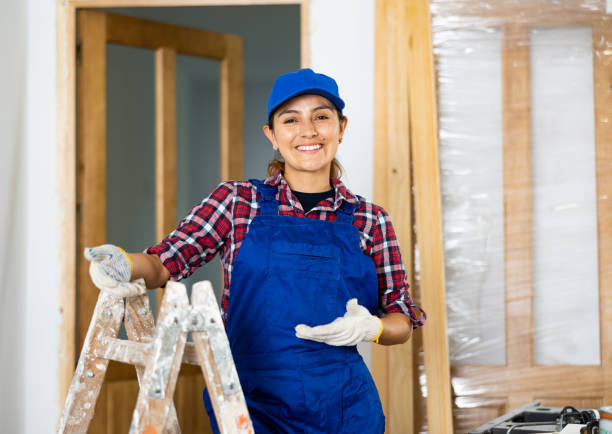 istock Young woman builder posing next to a stepladder in room being renovated 1448890875