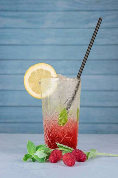 istock Italian soda with raspberry and lemon slice. concept: refreshing beverage 1448899400