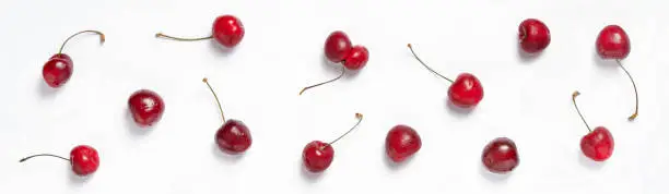 Red summer Ñherry berries, top view. Fresh cherries on white background. Banner for design web site. Food concept.