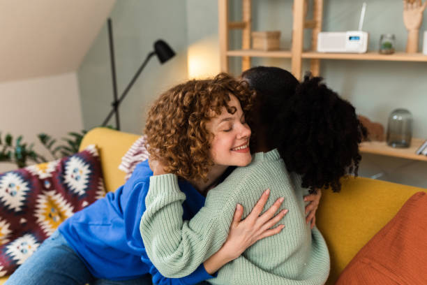 istock Two female friends relaxing at home 1448914389
