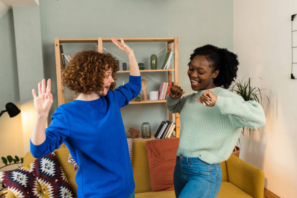 istock Two female friends relaxing at home 1448914546