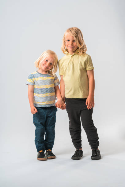 istock Caucasian Brothers Holding Hands 1448914806