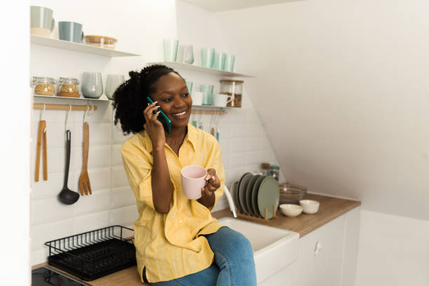 istock Woman enjoying at home and using smartphone 1448917433