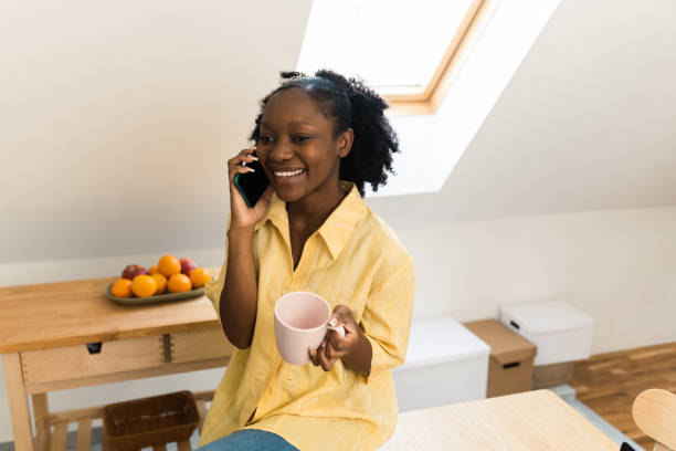 istock Happy woman relaxing and using mobile phone 1448917460
