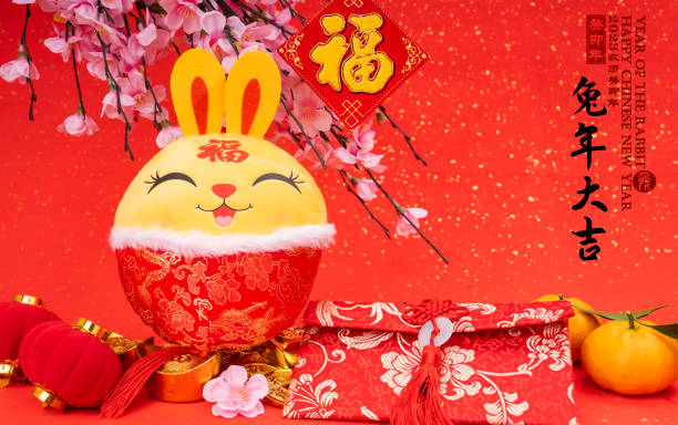Tradition Chinese cloth doll rabbit,2023 is year of the rabbit,Chinese golden characters Translation:good bless for year of the rabbit,rightside word and seal mean:Chinese calendar for the year