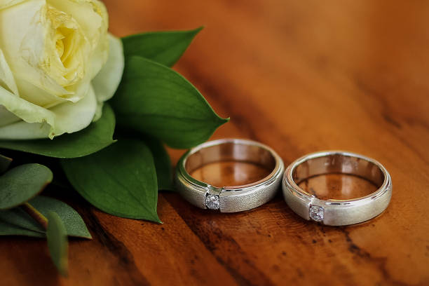 istock flowers and wedding rings 1448925284