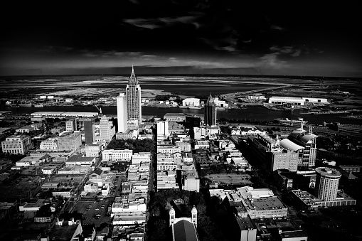 Black and white image of the urban skyline of Mobile, Alabama shot from an altitude of about 500 feet.