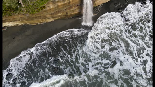 Waterfall Pan down to waves