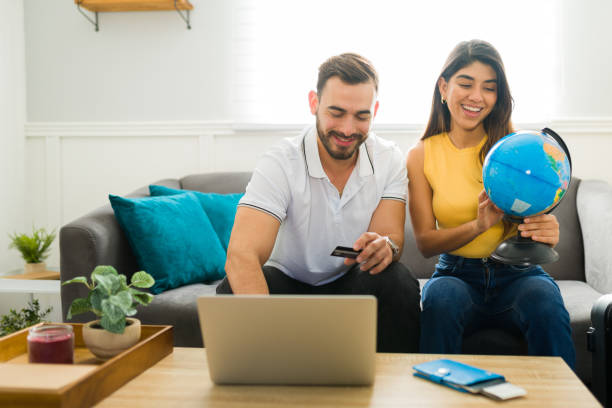 istock Excited couple booking a vacation trip online 1448932898