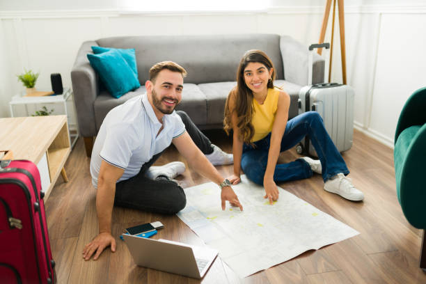 istock Cheerful couple preparing for their road trip or vacations 1448932992