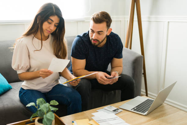 istock Couple at home doing their finances 1448933992