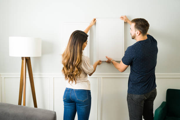 istock Attractive couple decorating their new home 1448934092