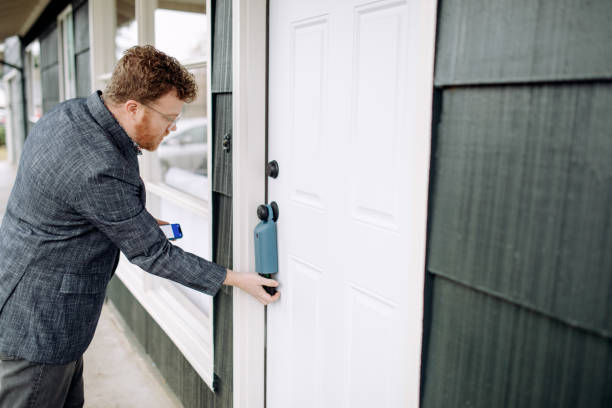 istock Real Estate Agent Preparing To Show Home Uses Virtual Lockbox 1448935296