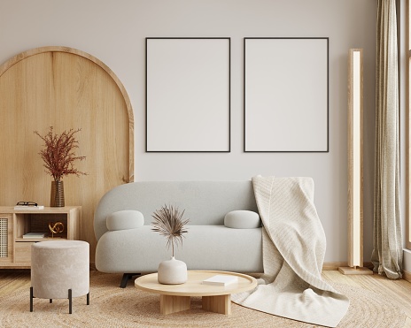 Mock up poster frame with gray sofa in modern interior background.3d rendering