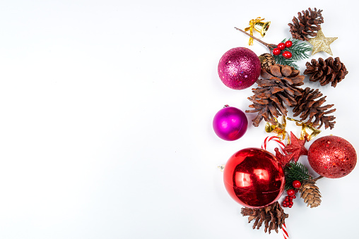 Pine cones and stars with Christmas bells and Christmas balls with empty spaces on a white background. Christmas decoration. Empty space for copy space