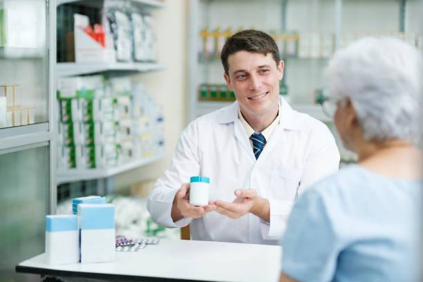 istock Pharmacist talking to a client about prescribed medications. 1448940521