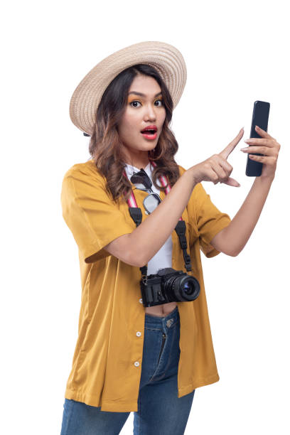 istock Asian woman with a hat and camera using a mobile phone 1448944579