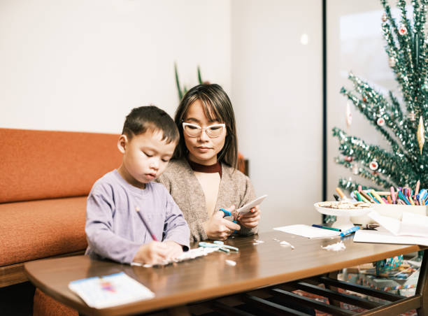 istock Mother and son doing Christmas arts and crafts 1448951562