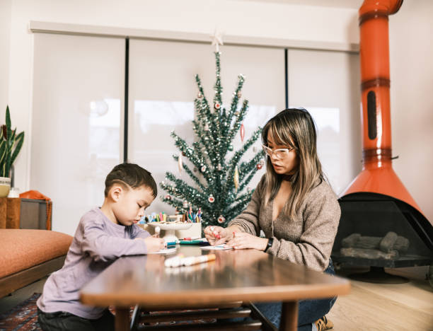 istock Mother and son doing Christmas arts and crafts 1448951694
