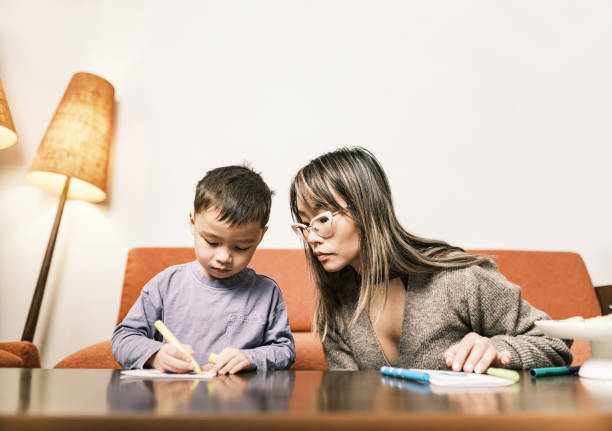 istock Mother and son doing Christmas arts and crafts 1448952407