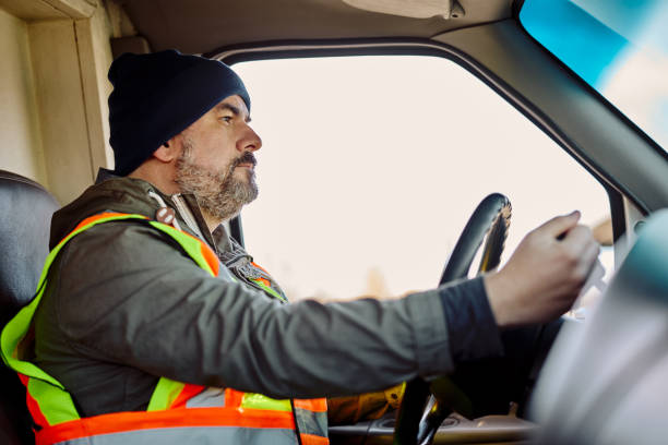 istock Mid adult man working as truck driver. 1448958302