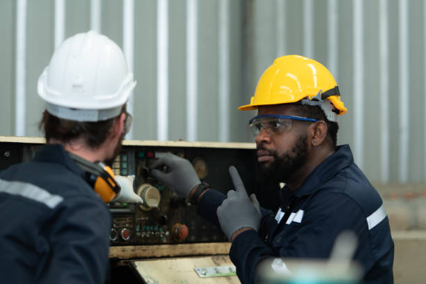 istock Both of engineers are consulting and exchanging repair experience with each other. 1448962594