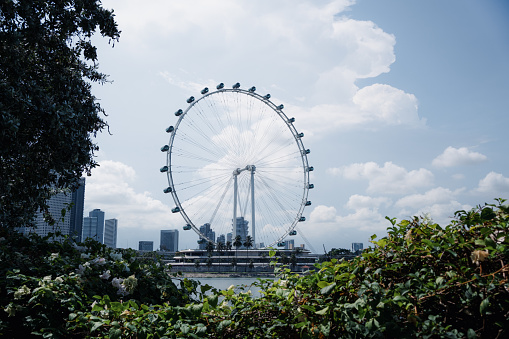 Singapore - July 21, 2022: The Singapore Flyer is an observation wheel at Marina bay.