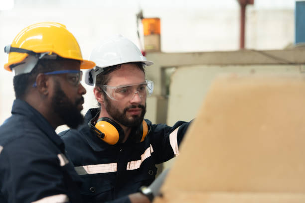 istock Both of engineers are consulting and exchanging repair experience with each other. 1448962977