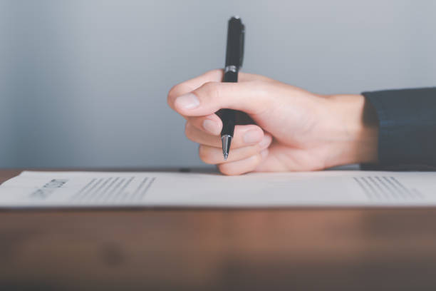 istock business accounting documents,auditor,management and auditing of office documents,Reports for Tax Time Analysis,office worker working with documents at home office desk,work at home 1448974350