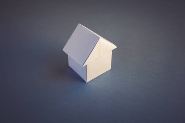 istock White paper house origami isolated on a grey background 1448975934